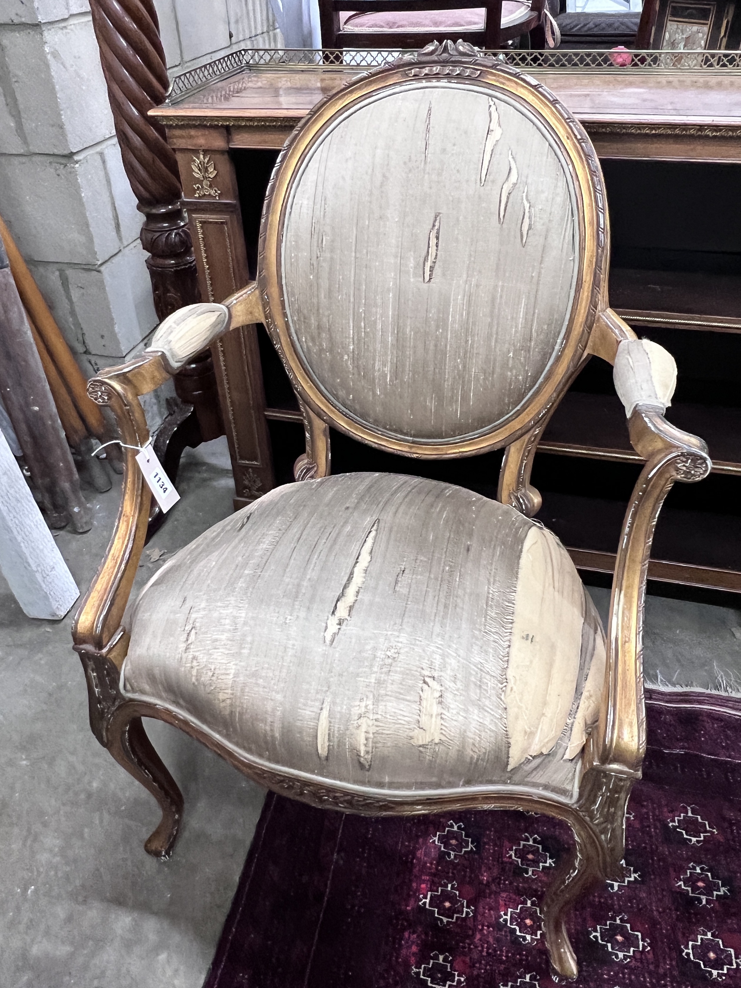 A Louis XVI style giltwood elbow chair, width 61cm, height 94cm